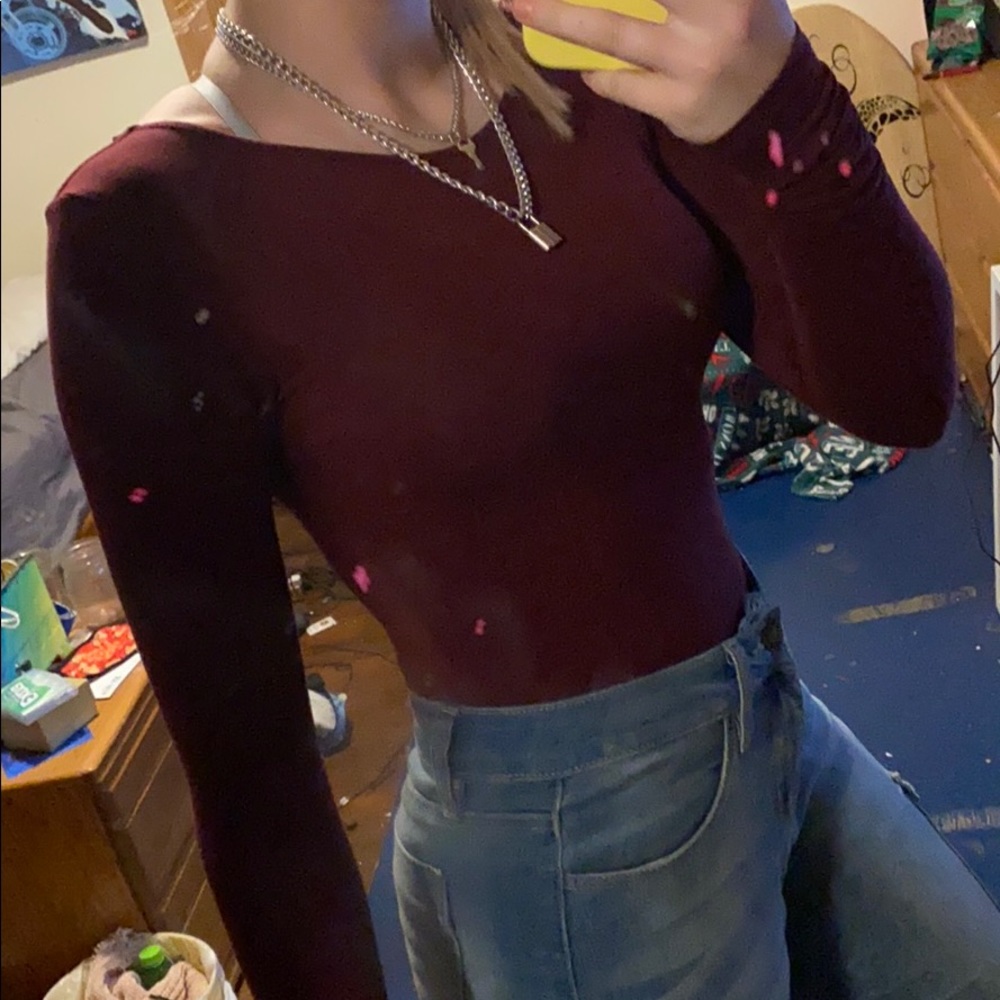 Red body suit with a crossed back